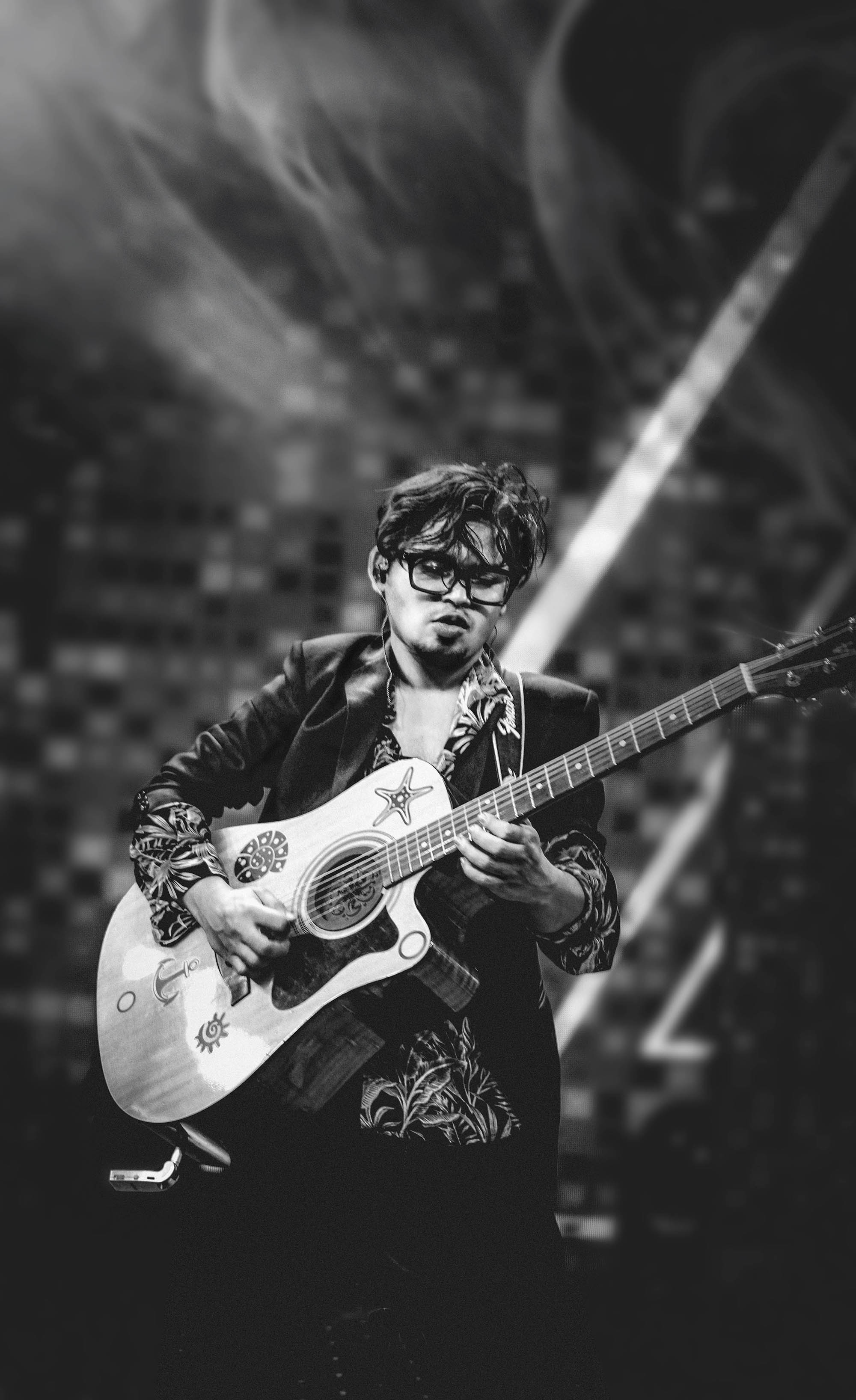 Saleh Samee with acoustic guitar